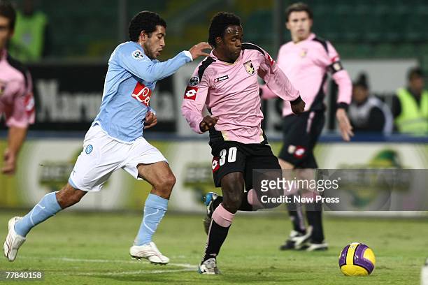 Fabio Simplicio of Palermo is tackled by Walter Gargano of Napoli during the Serie A match between Palermo and Napoli at the Stadio Renzo Barbera on...