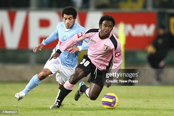 Fabio Simplicio of Palermo drives past Walter Gargano of Napoli during the Serie A match between Palermo and Napoli at the Stadio Renzo Barbera on...