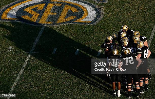 Quarterback Mackenzi Adams of the Vanderbilt Commodores calls the offensive play in the huddle against the Kentucky Wildcats during the second half...