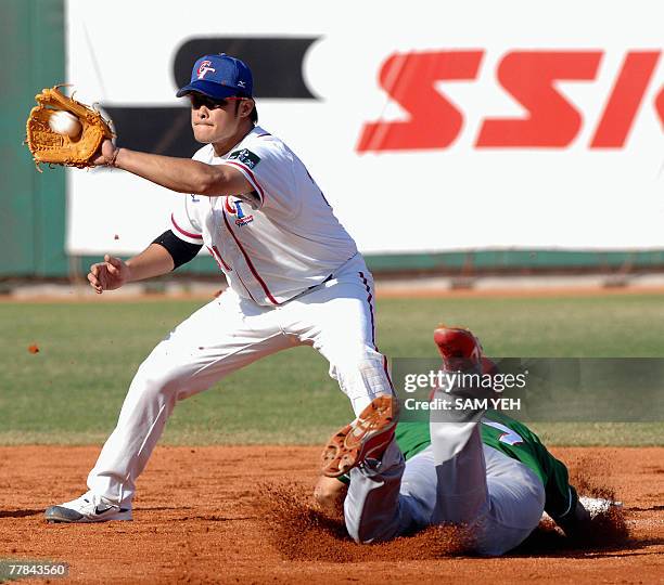 Taiwan's Lin Chih-sheng takes the throw as Mexico's Lorenzo Buelna slides into second base during the 37th Baseball World Cup in Taichung, central...