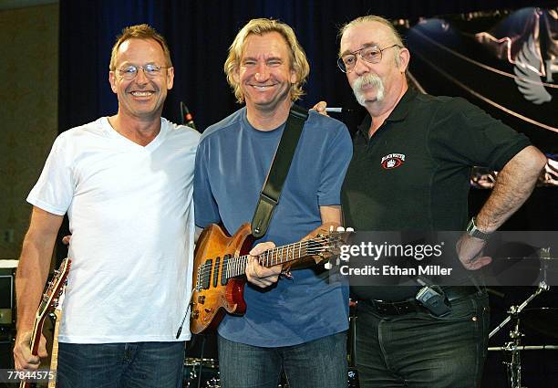 Bad Company's Simon Kirke, guitarist Joe Walsh of the Eagles and guitarist Jeff "Skunk" Baxter, pose during the 10th anniversary of Rock 'n' Roll...