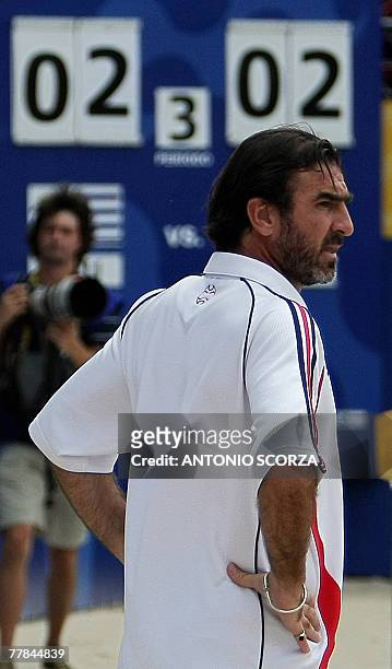 France's beach soccer coach Eric Cantona reacts after goalkeeper Jean Marie Aubry failed to stop the ball kicked by Uruguay's Ricar in a penalty...