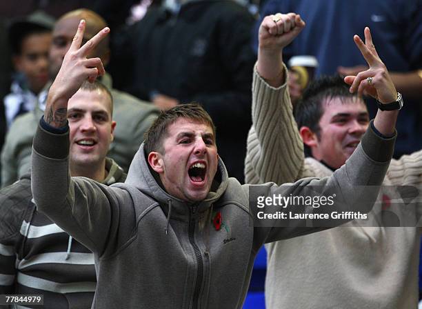 Birmingham fan celebrates the equalising goal scored by Mikael Forssell during the Barclays Premier League match between Birmingham City and Aston...