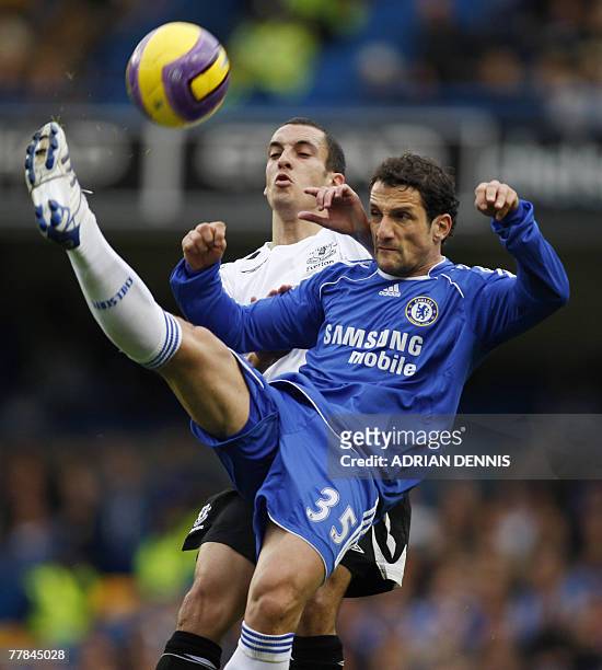 Chelsea's Juliano Belletti clears the ball in front of Everton's Leon Osman during their Premiership football match at Stamford Bridge in London 11...