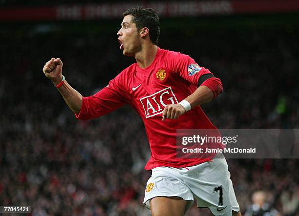 Cristiano Ronaldo of Manchester United celebrates scoring his team's second goal during the Barclays Premier League match between Manchester United...