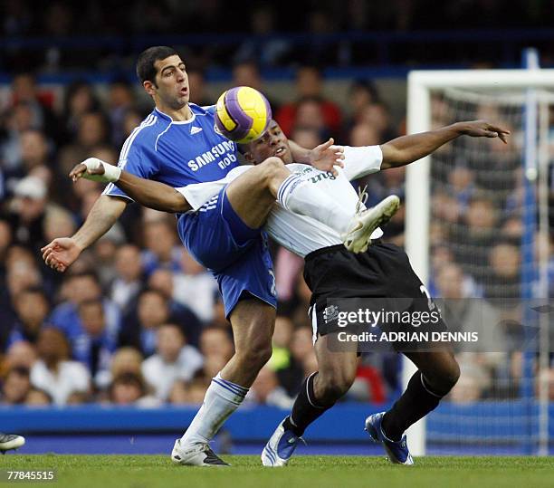 Chelsea's Tal Ben Haim vies for the ball against Everton's Victor Anichebe during the Premiership football match at Stamford Bridge in London 11...