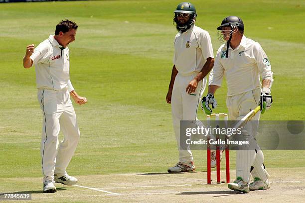 Dale Steyn celebrates the wicket Scott Styris as Hashim Amla looks on during day four of the 1st test match between South Africa and New Zealand held...