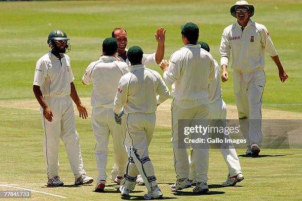 Jacques Kallis and his team mates celebrate the wicket of Michael Papps during day four of the 1st test match between South Africa and New Zealand...