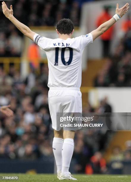 Tottenham's Robbie Keane gestures at the crowd in the first half of his Premiership football match against Wigan at the Tottenham ground in north...