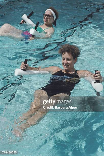 Guests taking part in a water aerobics class in a swimming pool at the Safety Harbor Resort and Spa in Clearwater, Florida, June 1989.