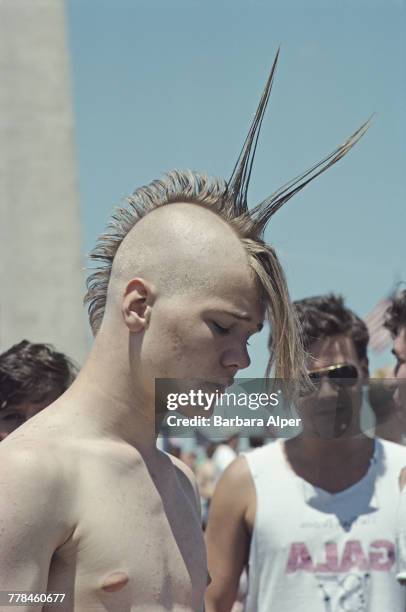 Young man with a spiked mohawk hairstyle at a PETA demonstration in Washington DC, June 1988.