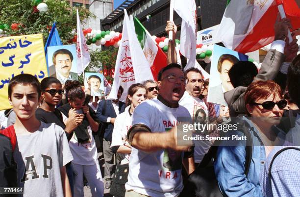 Demonstrators gather outside the United Nations building September 5, 2000 in New York City's Dag Hammarskjold Plaza to protest against the human...