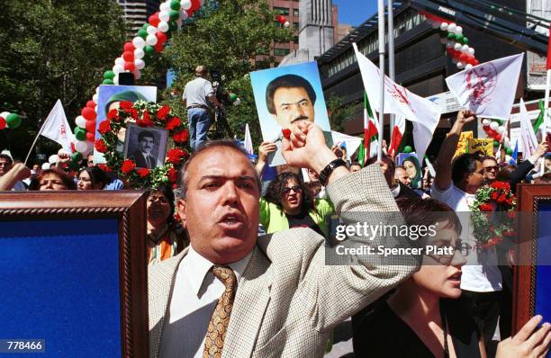 Demonstrators gather outside the United Nations building September 5, 2000 in New York City's Dag Hammarskjold Plaza to protest against the human...