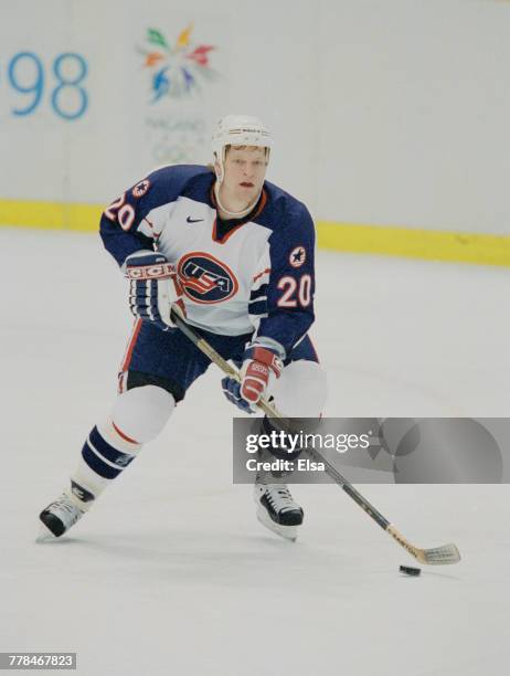 Gary Suter of the United States controls the puck during the Group D game against Canada in the Men's Ice Hockey tournament on 16 February 1998...