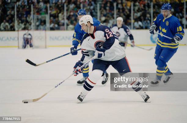 Bill Guerin of theUnited States controls the puck during the Group D game against Sweden in the Men's Ice Hockey tournament on 13 February 1998...