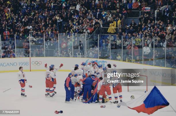 Players from the Czech Republic celebrate winning the Gold Medal game against Russia in the Men's Ice Hockey tournament on 22 February 1998 during...