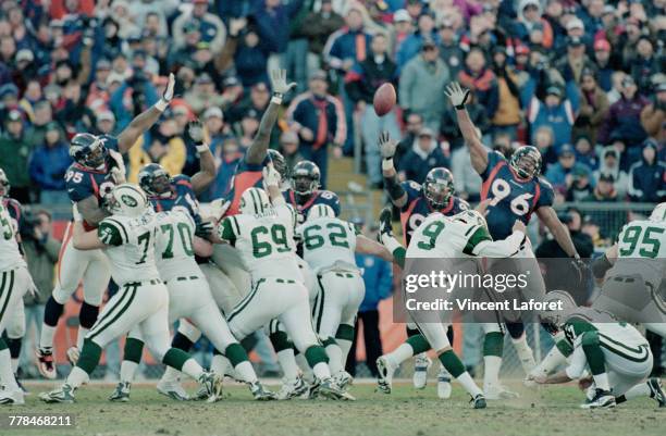 John Hall, Kicker for the New York Jets kicks a 32 yard field goal during the American Football Conference Championship game against the Denver...