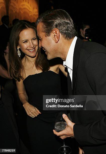 Kelly Preston and George Clooney