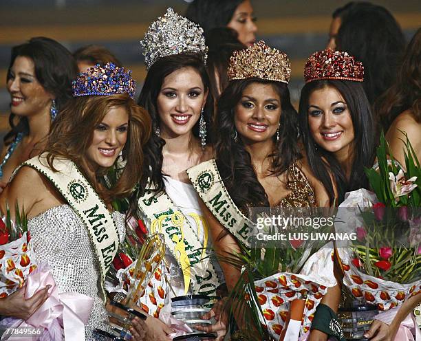 Miss Earth 2007, Miss Canada Jessica Nicole Trisko , is flanked by Miss Earth-Water, Silvana Santaella Arellano from Venezuela, Miss Earth-Air, Pooja...