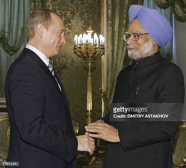 Russian President Vladimir Putin shakes hands with Indian Prime Minister Manmohan Singh during their meeting 12 November 2007, at the Kremlin in...