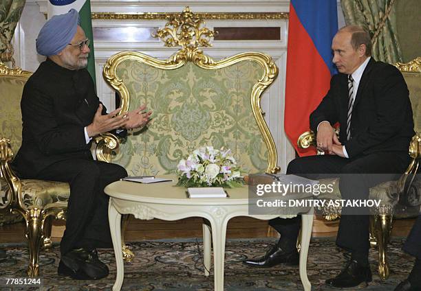 Russian President Vladimir Putin listens to Indian Prime Minister Manmohan Singh during their meeting 12 November 2007, at the Kremlin in Moscow....