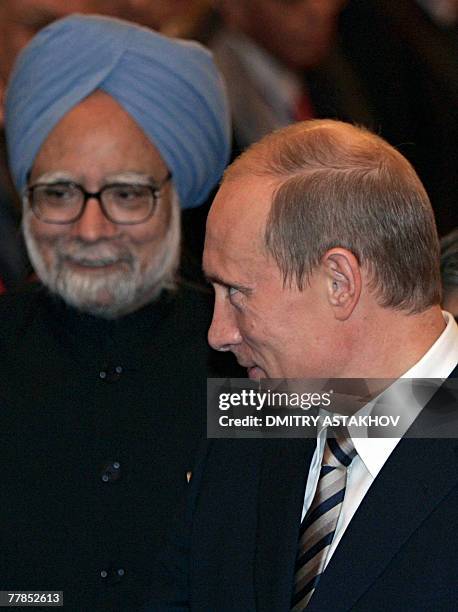 Russian President Vladimir Putin welcomes Indian Prime Minister Manmohan Singh during their meeting in the Kremlin in Moscow, 12 November 2007....