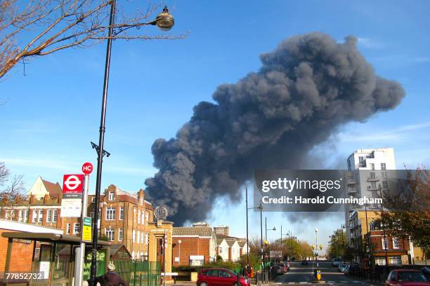 Plumes of black smoke rise from a fire in the vicinity of Waterden Road, Hackney Wick on November 12, 2007 in London England. The location of the...