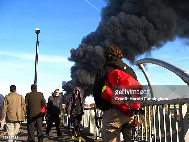 Plumes of thick black smoke rise from a fire in the vicinity of Waterden Road, Hackney Wick on November 12, 2007 in London England. The location of...
