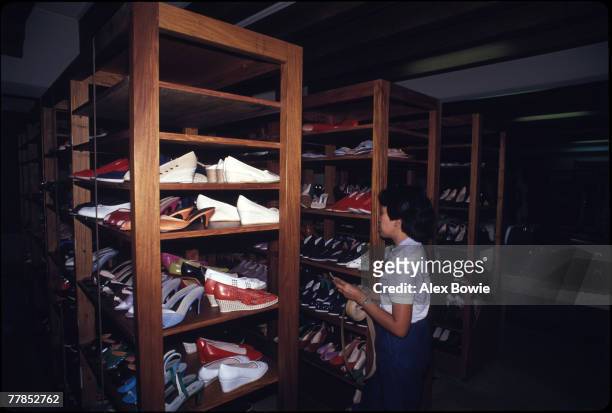 An inventory is made of shoes belonging to former First lady of the Philippines, Imelda Marcos, in a cellar under her bedroom at Malacanang Palace,...
