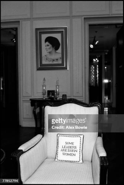 Portrait of former First lady of the Philippines, Imelda Marcos, along with a cushion with the embroidered text 'some leaders are born women' found...