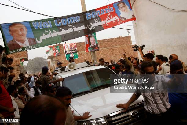Former Pakistani Prime Minister and head of Pakistan People's Party , Benazir Bhutto, departs the village of a PPP supporter killed in the Karachi...