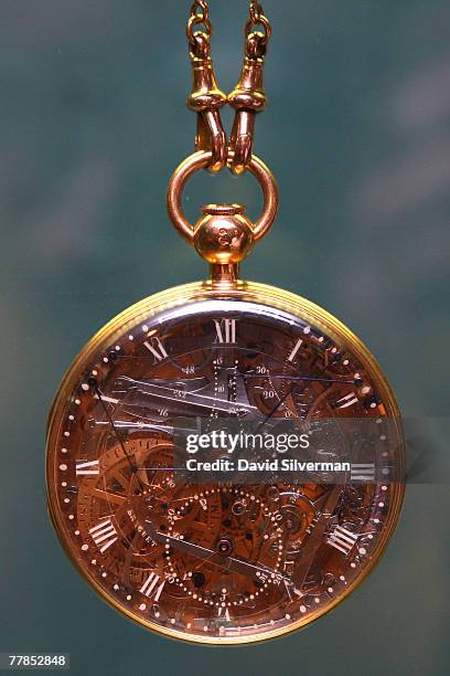 Museum employee displays the recently recovered gold and rock-crystal pocket watch made for the French queen Marie Antoinette, at the L. A. Meyer...