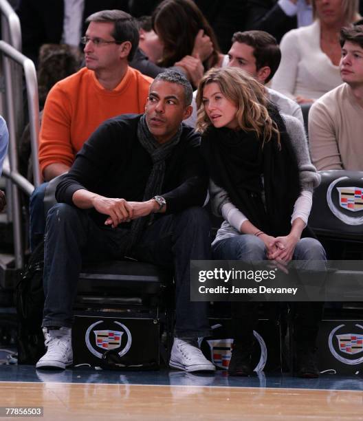 Music producer Christopher Ivery and actress Ellen Pompeo attend NY Knicks vs Miami Heat game at Madison Square Garden in New York City on November...