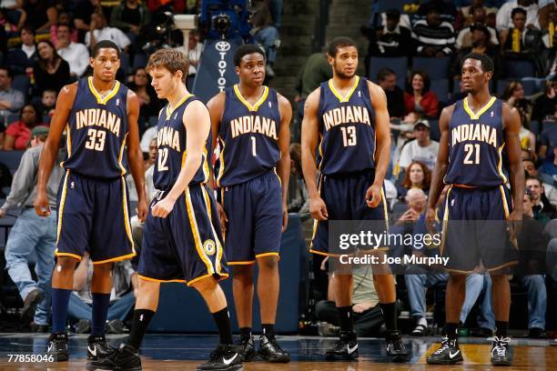 Danny Granger, Travis Diener, Ike Diogu, David Harrison and Kareen Rush of the Indiana Pacers stand on the court during the game against the Memphis...