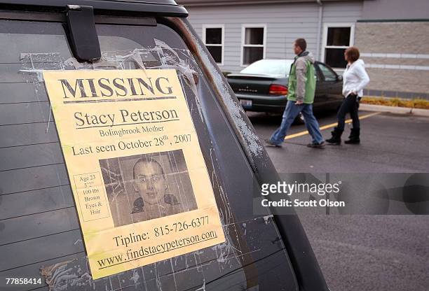 Flyer taped to the window of a car advertises that a search continues for Stacy Peterson, the wife of Bolingbrook, Illinois police officer Drew...