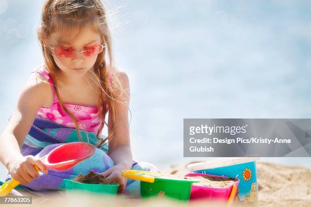 girl building sand castle - kelowna stock pictures, royalty-free photos & images