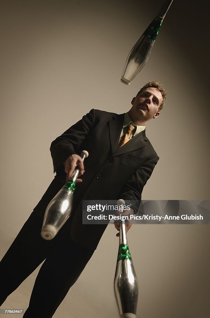 Businessman juggling