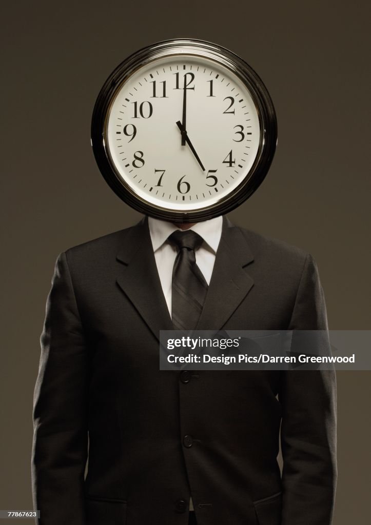 Man in suit with clock face