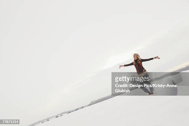 woman standing in snow - edmonton winter stock pictures, royalty-free photos & images