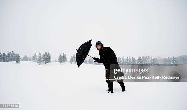 man battling against the snow - edmonton winter stock pictures, royalty-free photos & images