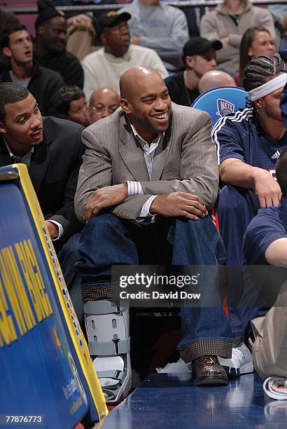 Vince Carter of the New Jersey Nets sits on the bench due to a sprained ankle during the game against the New Orleans Hornets at the Izod Center...