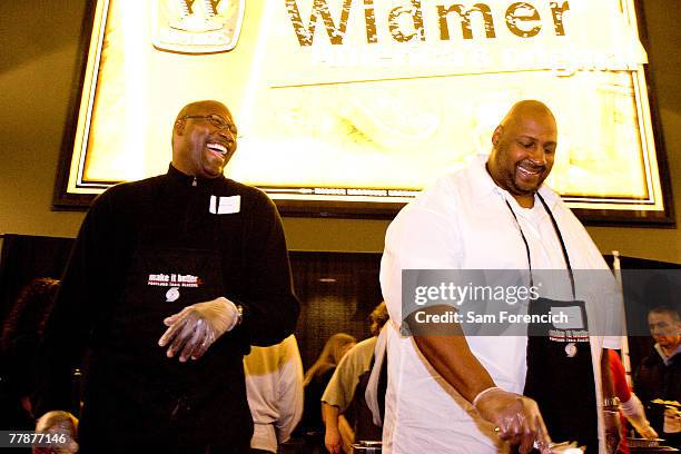 Former Portland Trail Blazer players Jerome Kersey and Kevin Duckworth serve food during the team's 12th annual Harvest Dinner, November 12, 2007 at...