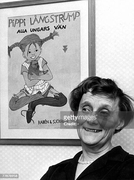 File photo taken 26 January 1966 shows Swedish writer Astrid Lindgren posing in front of a book cover with her most popular character Pippi...