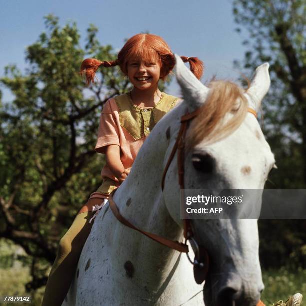 File photo taken 01 May 1969 shows a still from the movie "Pippi Longstocking" with Inger Nilsson as Pippi on her horse, Little Gubben. Swedish...