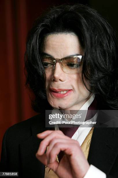 Entertainer Michael Jackson leaves the courtroom at the Santa Barbara County Courthouse during a break in his the child molestation trial of...