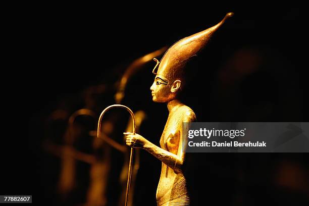 Statues of young Tutankhamen are pictured during the press viewing of the 'Tutankhamun Exhibition & The Golden Age of the Pharaohs' at the O2 Centre...