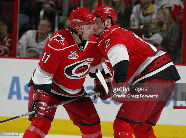 Eric Staal of the Carolina Hurricanes talks strategy with Justin Williams a game against the Washington Capitals on November 5, 2007 at RBC Center in...