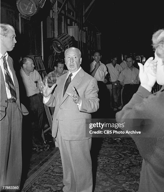 British-born American film and television director Alfred Hitchcock directs American actors James Stewart and Doris Day in a scene from his film 'The...