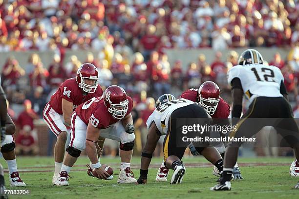 Sam Bradford of the Oklahoma Sooners calls the play during a game against the Missouri Tigers at Memorial Stadium on October 13, 2007 in Norman,...