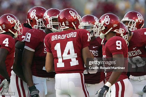 Sam Bradford of the Oklahoma Sooners leads the huddle during a game against the Missouri Tigers at Memorial Stadium on October 13, 2007 in Norman,...